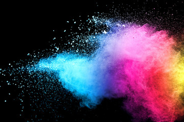 Explosion of colored powder isolated on black background. Abstract colored background. holi...