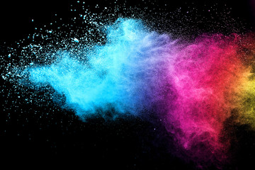 Explosion of colored powder isolated on black background. Abstract colored background. holi festival.