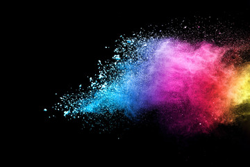 Explosion of colored powder isolated on black background. Abstract colored background. holi festival.