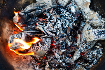 Embers in a bonfire close-up