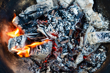 Embers in a bonfire close-up