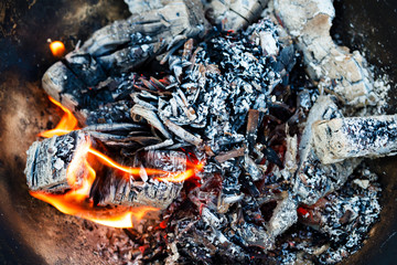 Embers in a bonfire close-up