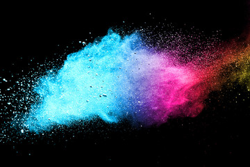 Explosion of colored powder isolated on black background. Abstract colored background. holi festival.