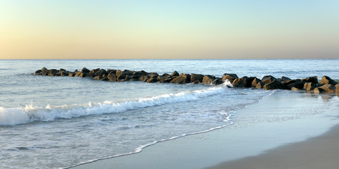 A rock jetty in the early morning