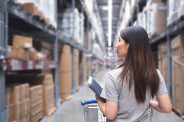Asian woman in Home center Warehouse to buy a retail furniture and home accessories store