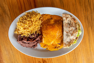 Cheese Enchilada meal with rice, beans and beef taco