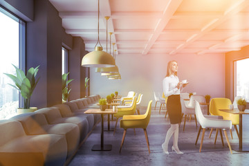 Woman in modern cafe interior