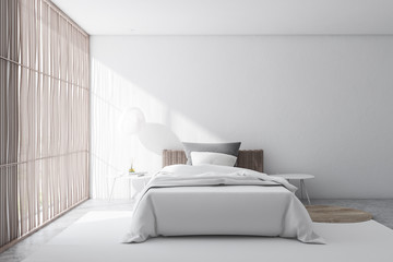 Stylish white bedroom interior with blinds