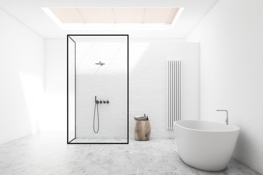 White bathroom interior with shower and tub