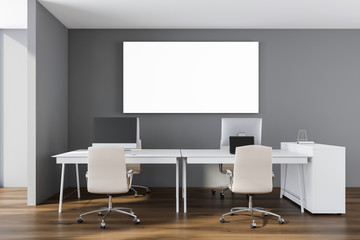 Gray office interior with horizontal poster