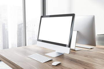 Fototapeta premium Mock up computer screen on wooden office table