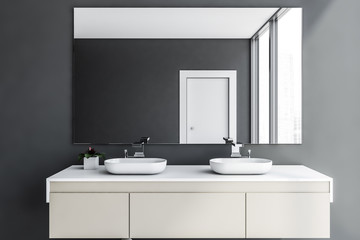 Close up of double sink in gray bathroom