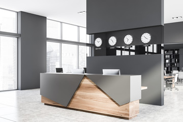 Gray and wood reception desk in office corner