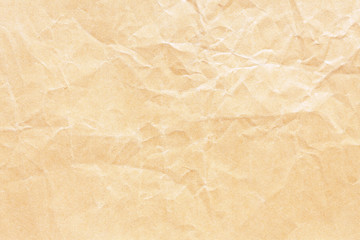 Old brown crumpled Kraft paper background texture