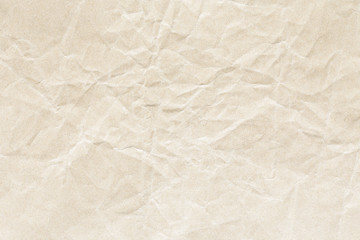 Old brown crumpled Kraft paper background texture