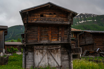 Popular Swiss mountain chalet in the little village named Ernen. Small town in the canton of Valais in Switzerland. Typical wooden house in the alpine canton of Valais in Switzerland.