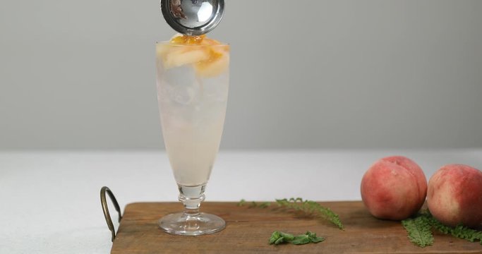 Making cold peach compote ade for summer drink
