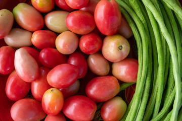 Fresh raw long bean and tomatoes background, Prepare to Somtam or spicy papaya salad thai style food.