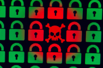 Skull and bone as a symbol of hacking programs or personal information and data. Cyber crime. Green pixel castles and a red skull with bones on a black background, close-up