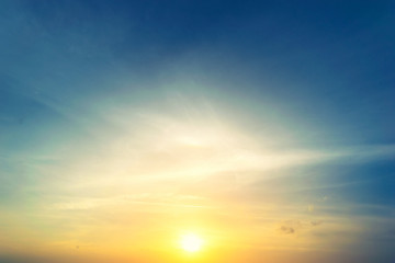 Dramadic Sunset Sky blue and orange light of the sun through the clouds in the sky