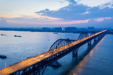 Fototapeta na wymiar jiujiang yangtze river bridge in nightfall