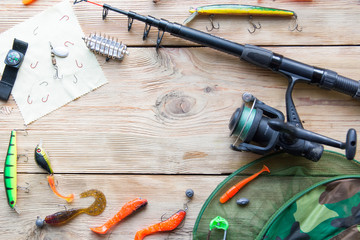 fishing tackle on a light old wooden background © FytyaKarman