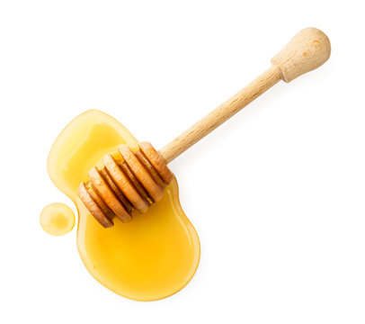 Stick with honey on a white background. The view of the top.