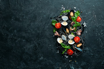 Pasta with seafood. Black paste. Seafood. Top view. Free copy space.