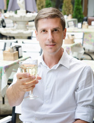 man drinking wine in restaurant