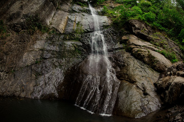 Fototapeta na wymiar Shot of a small waterfall in the georgian mountains