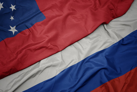 waving colorful flag of russia and national flag of Samoa.