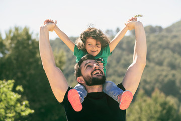father and daughter playing outdoors in day light