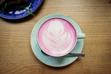 Cup of pink cappuccino