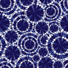 Vector blue shibori circle wheels overlap seamless pattern. With spiderweb detail. Suitable for textile, gift wrap and wallpaper.
