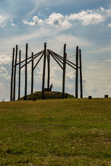 Photographer taking pictures of monument.