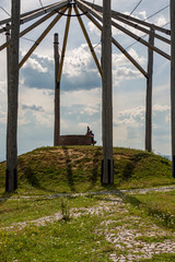 Photographer taking pictures of monument.