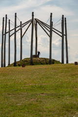 Photographer taking pictures of monument.