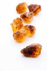 Brown caramelized sugar on white background.