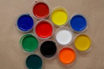 Many water colors are available in the cup. Colors are red, blue, green, yellow, brown, black.