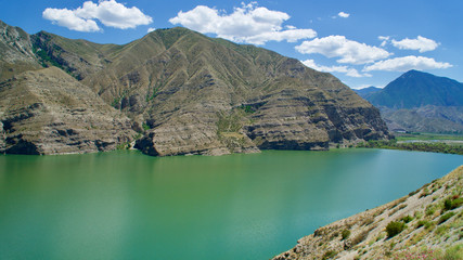 Erzurum, Tortum lake, cliff mountains and cloud reflection in water