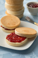 Dutch beschuitbollen with red strawberry jam