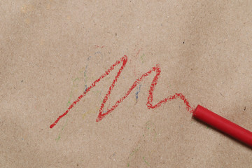 Red oil-colored bars written on brown background paper