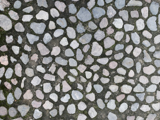 Cobblestone pavement texture up close