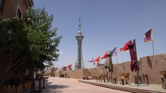  Kashgar Renovated Old City with Colorful Triangular Waving Flags on the Wall and TV Tower at Background on a Picturesque Sunny Day