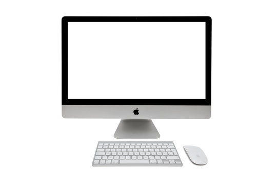 Apple iMac computer on the table. iMac is a range of all-in-one Macintosh desktop computers designed and built by Apple Inc