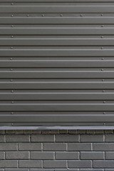 Gray city wall. Dark gray urban background. Copy space for text.Abstract background corrugated gray metal for wall pattern, industrial.