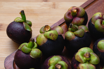 Mangosteen on the wooden floor
