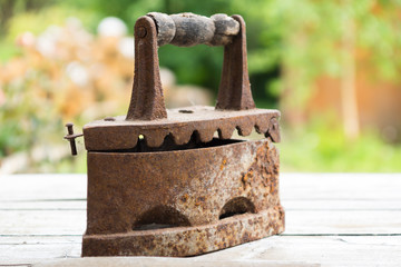 Vintage iron. Old rusty iron for ironing. Antique household item