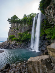 Fototapeta na wymiar Waterfall directly into ocean - Jeongbang, Jeju, South Korea