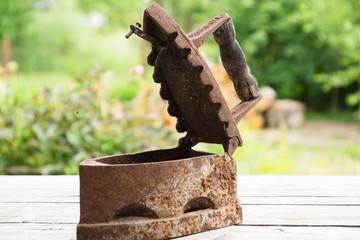 Vintage iron. Old rusty iron for ironing. Antique household item
